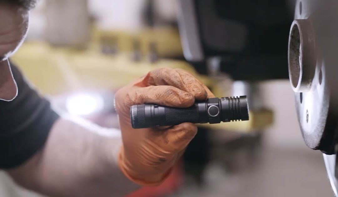 RP Motors mechanic checking a car brake disc